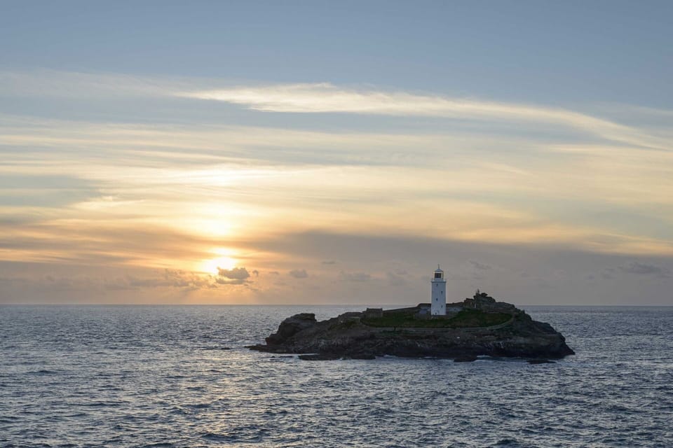 Godrevy Lighthouse sunset at Gwithian Towans Cornwall
