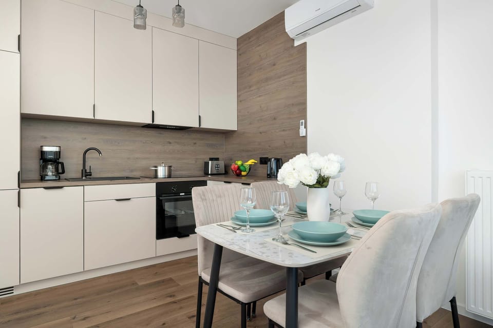 Stylish dining area with elegant tableware and fresh flowers.