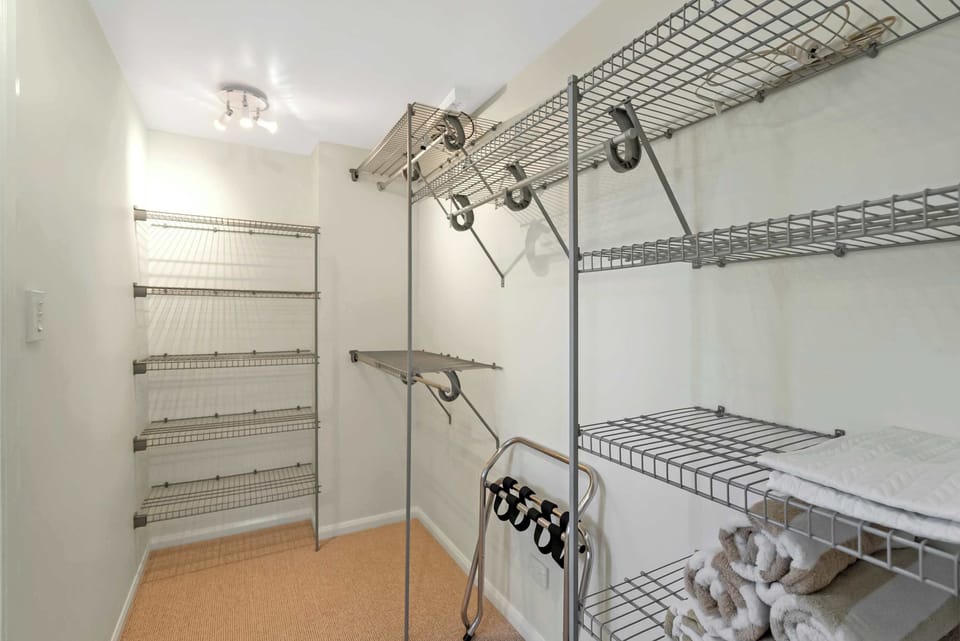 The generous walk-in wardrobe gives you plenty of space to unpack, settle in and feel at home from the moment you arrive.