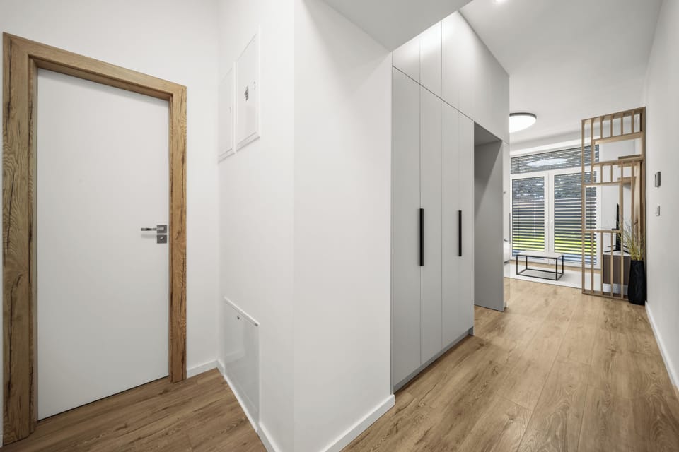 Bright modern entryway with built-in storage and natural light