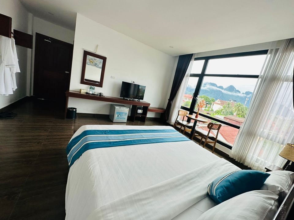 Deluxe Double Room, City View | Hypo-allergenic bedding available, pillowtop beds, in-room safe, desk