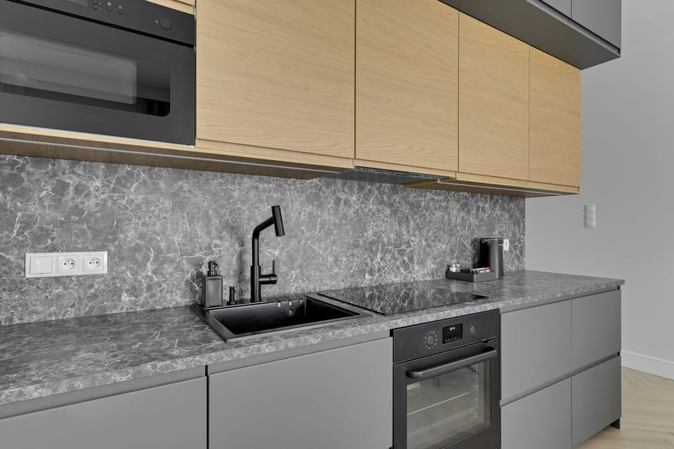 Deluxe Apartment, Patio, Garden View | Private kitchen | Coffee/tea maker, electric kettle, toaster, highchair