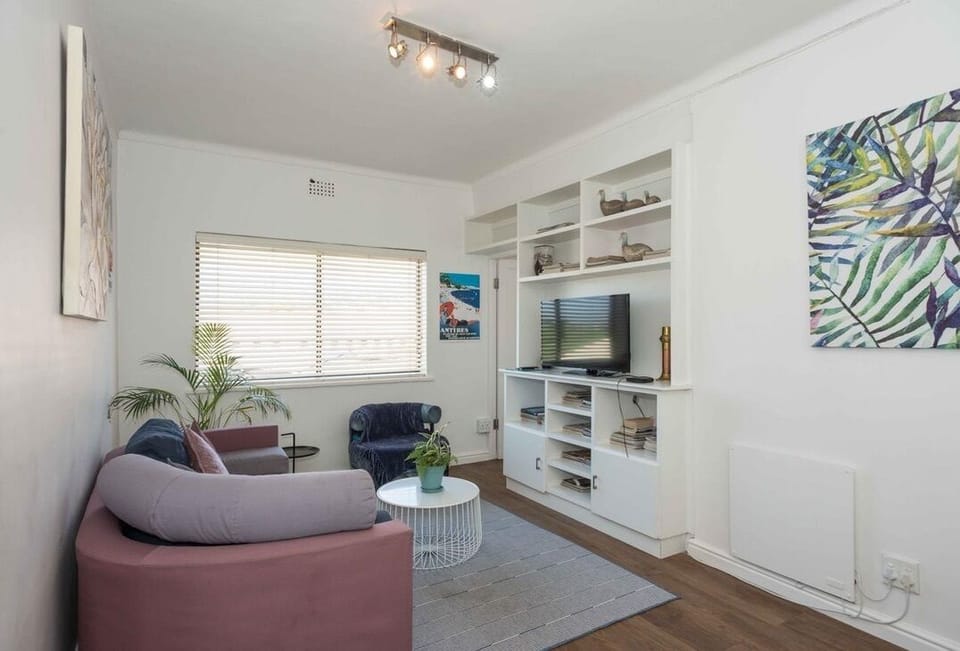Bright cozy lounge with built-in TV unit and stylish modern decor