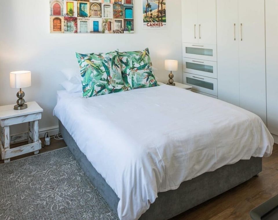 Bright bedroom with tropical accents and ample built-in storage
