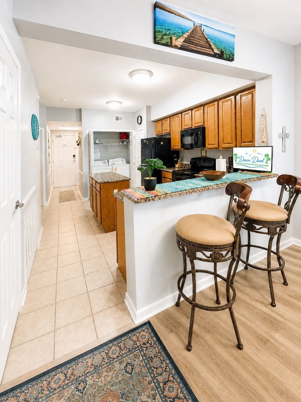 Kitchen & Breakfast Bar - The breakfast bar adds casual seating and extra space beside the kitchen.