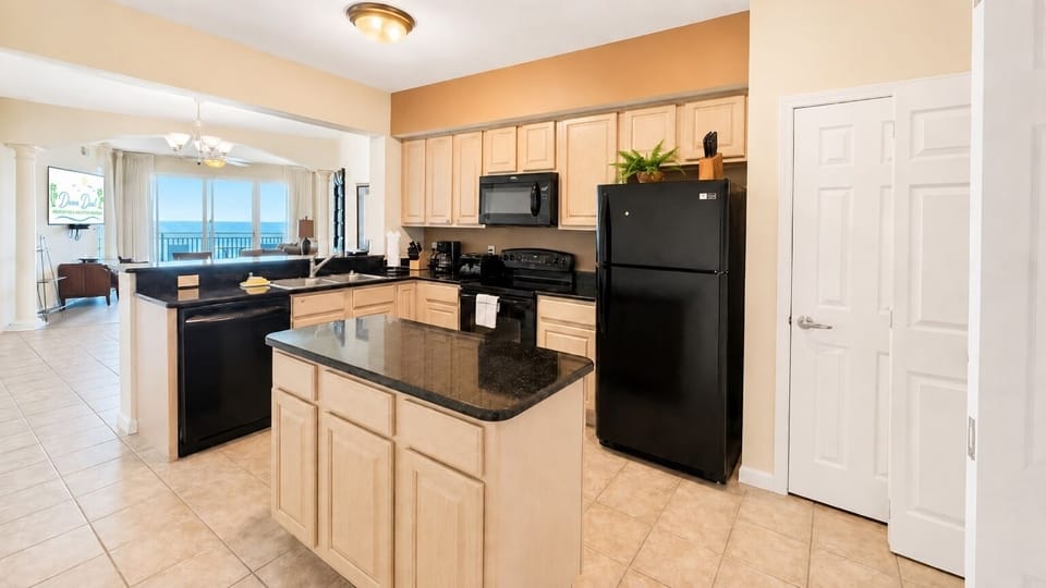 Open-Concept Coastal Kitchen - A spacious kitchen and open layout make vacation meals and entertaining easy.