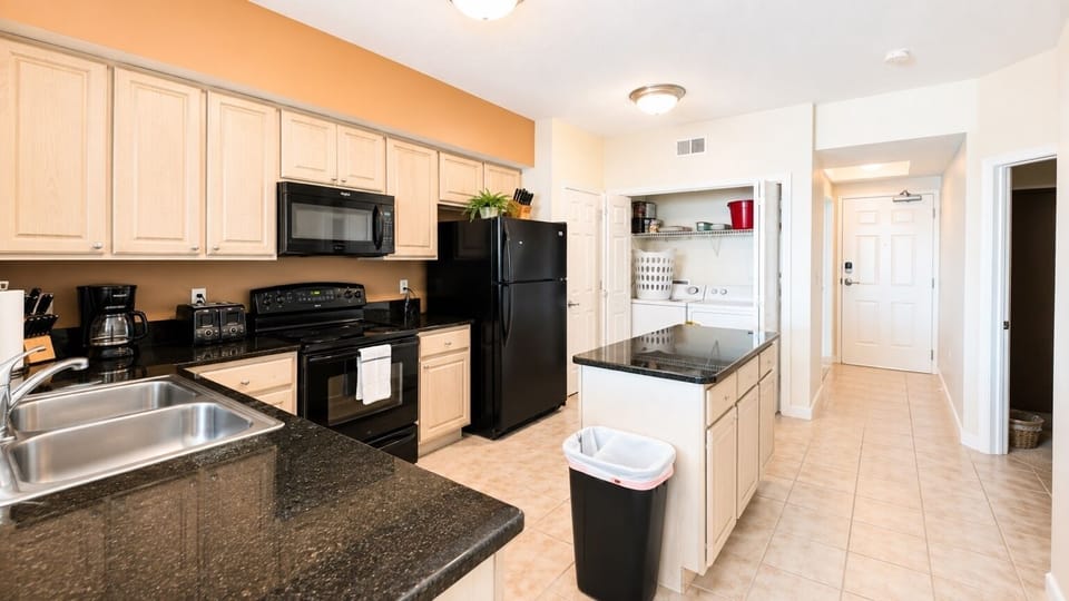 Fully Equipped Kitchen - Plenty of cabinetry, counter space and nearby laundry make longer stays feel effortless.