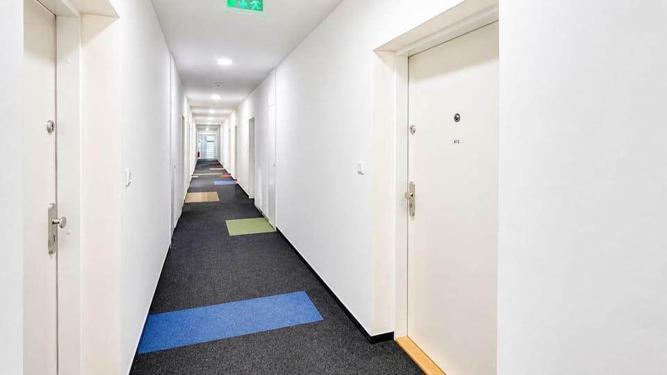 Bright, modern hallway with secure entry and colorful contemporary flooring