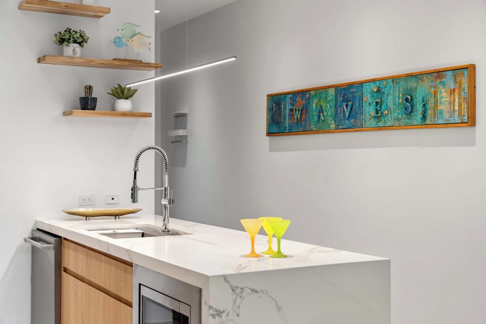 A bright kitchen corner with generous counter space and a clean, modern feel