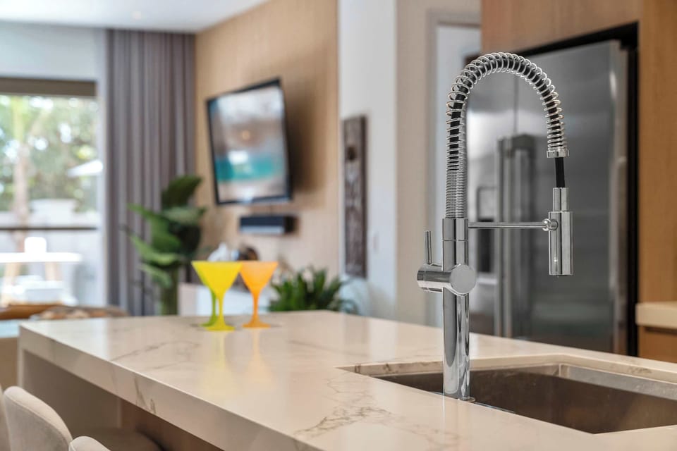 A sleek kitchen island that keeps you connected to the living space while you cook