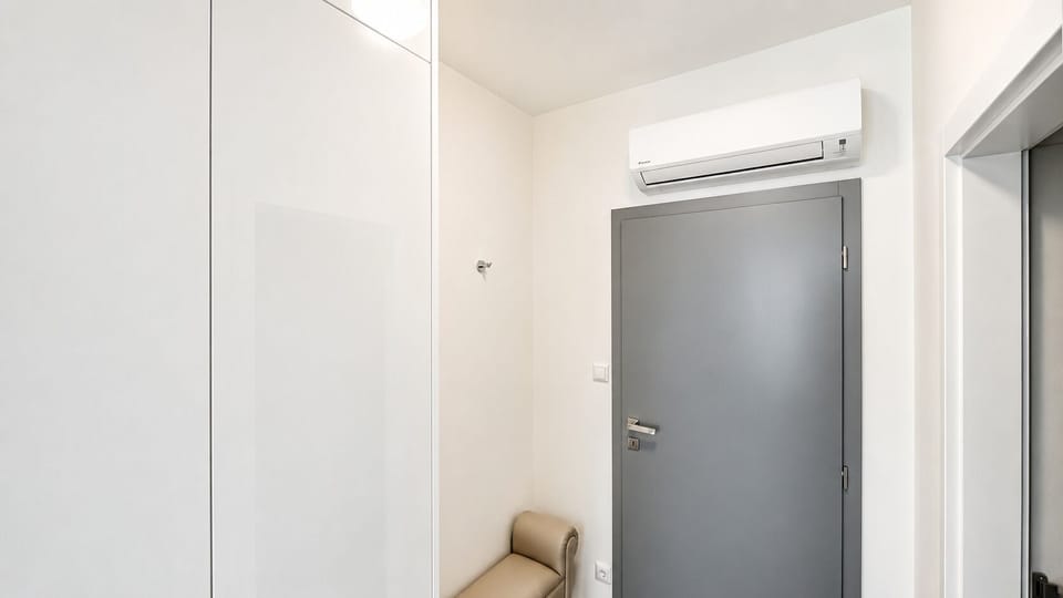 Bright modern entryway with built-in storage and A/C comfort