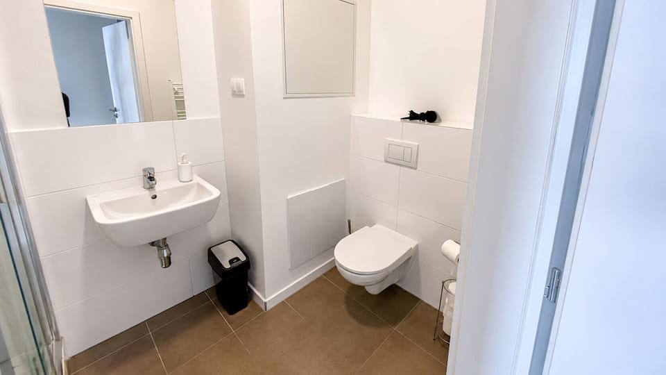 Bright modern bathroom with sleek fixtures and a clean, minimalist design