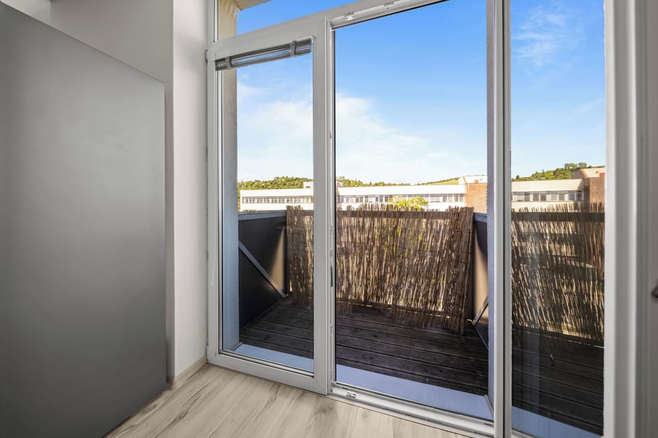 Bright room with private balcony and sunny outdoor seating space