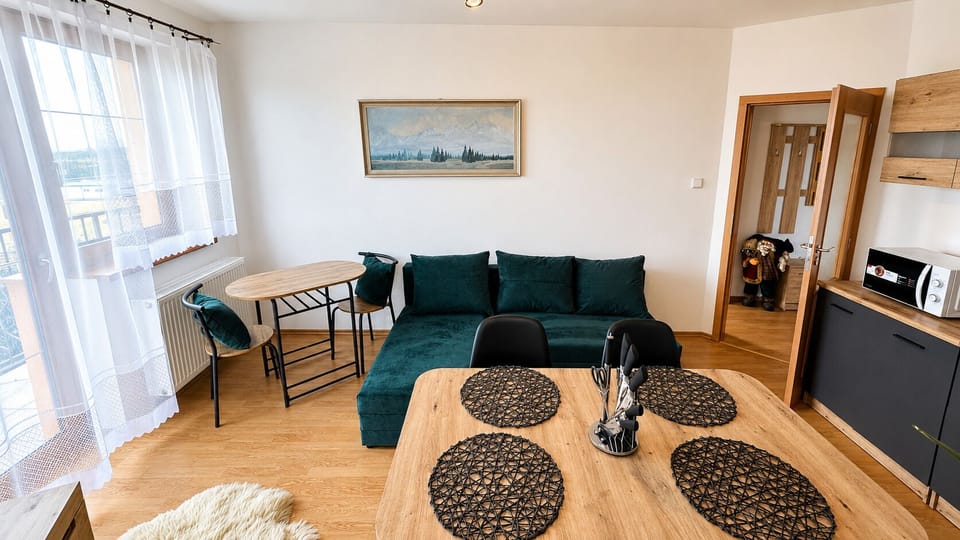 Bright modern living area with dining space and cozy sectional