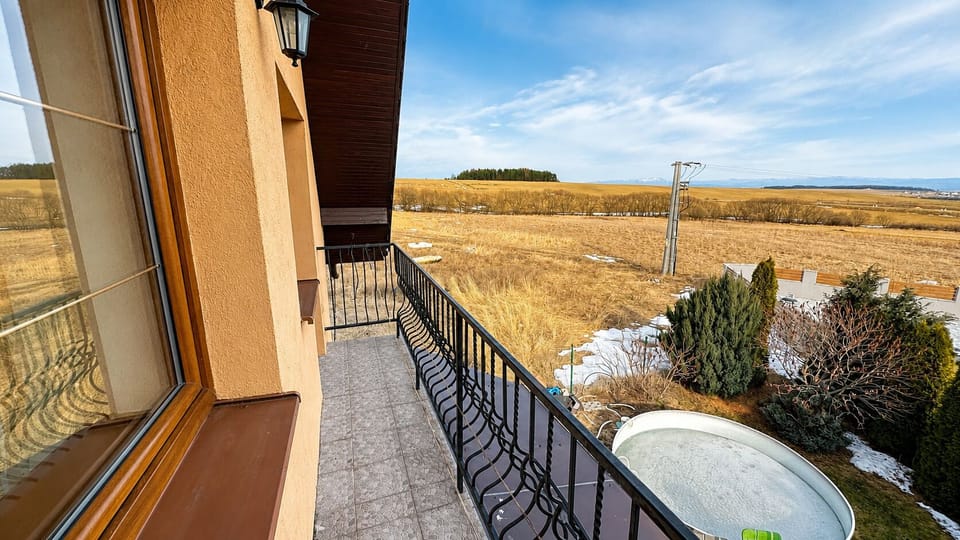 Private balcony with peaceful countryside views and fresh open-air charm