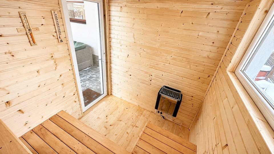 Cozy private wood sauna with natural light and relaxing spa vibes