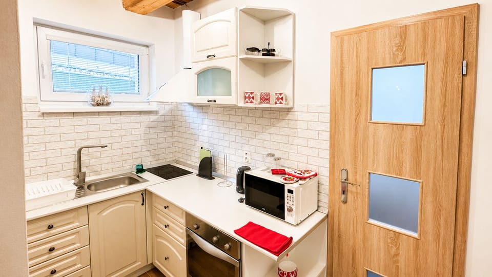 Bright, well-equipped kitchenette with modern finishes and natural light