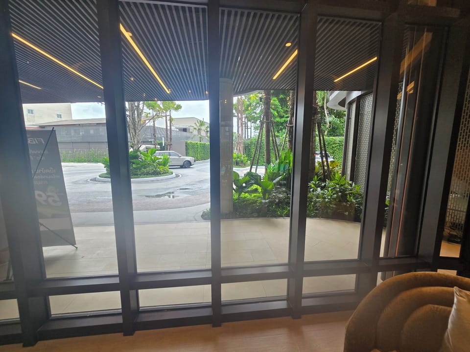 Bright modern lobby with garden views and a welcoming covered entry