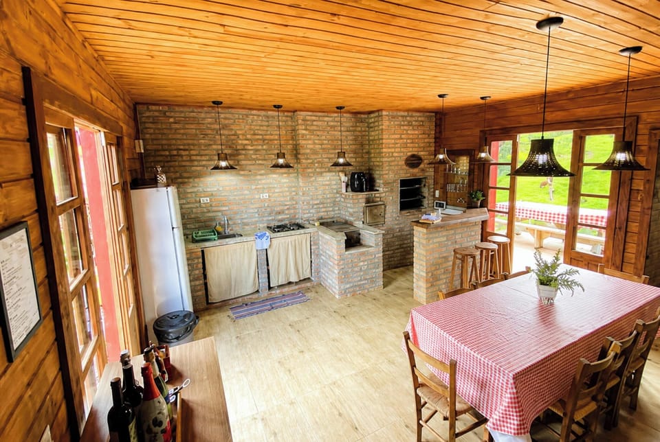 Family Cabin, 1 Bedroom, Fireplace, Lagoon View | Private kitchen | Fridge, microwave, cookware/dishes/utensils, dining table