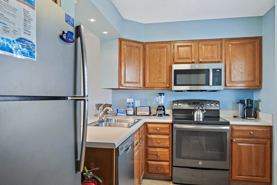 Full kitchen that looks out over the living area