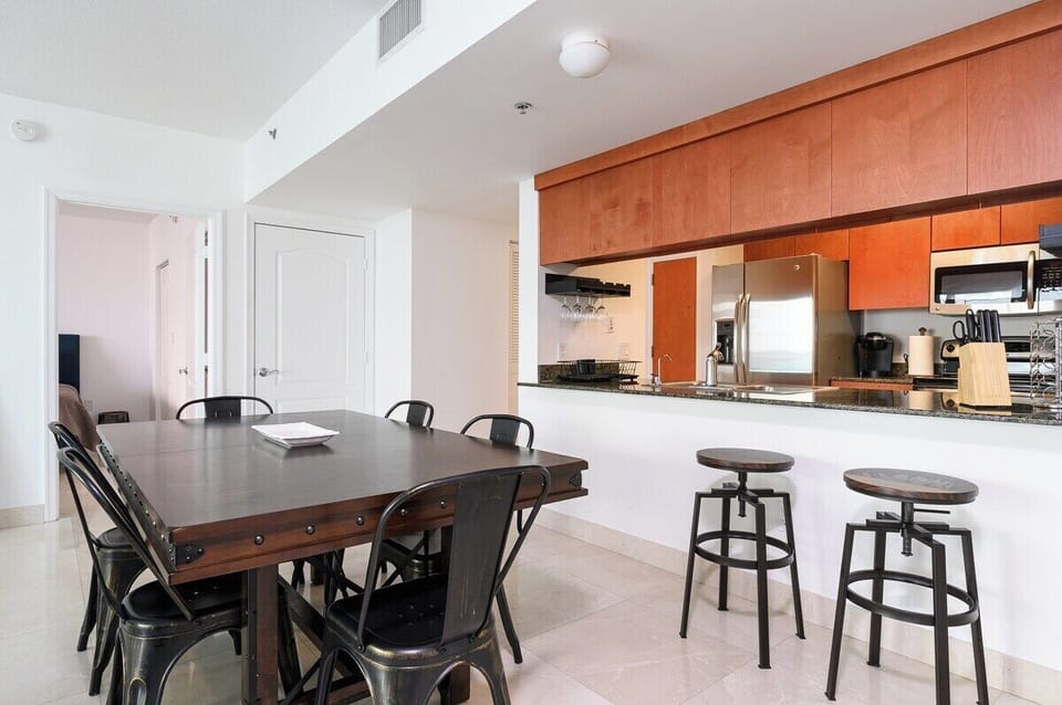 Start your day at the breakfast bar or whip up meals in a sleek kitchen with stainless steel appliances. Ideal for extended stays and foodie travelers.