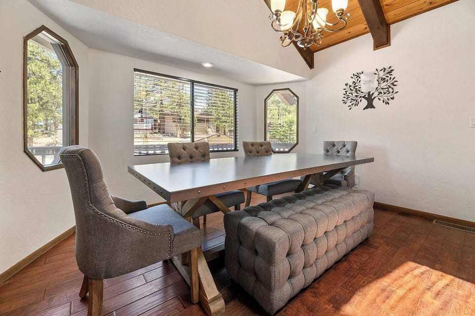 The dining table can easily accommodate the whole group for a gourmet meal.