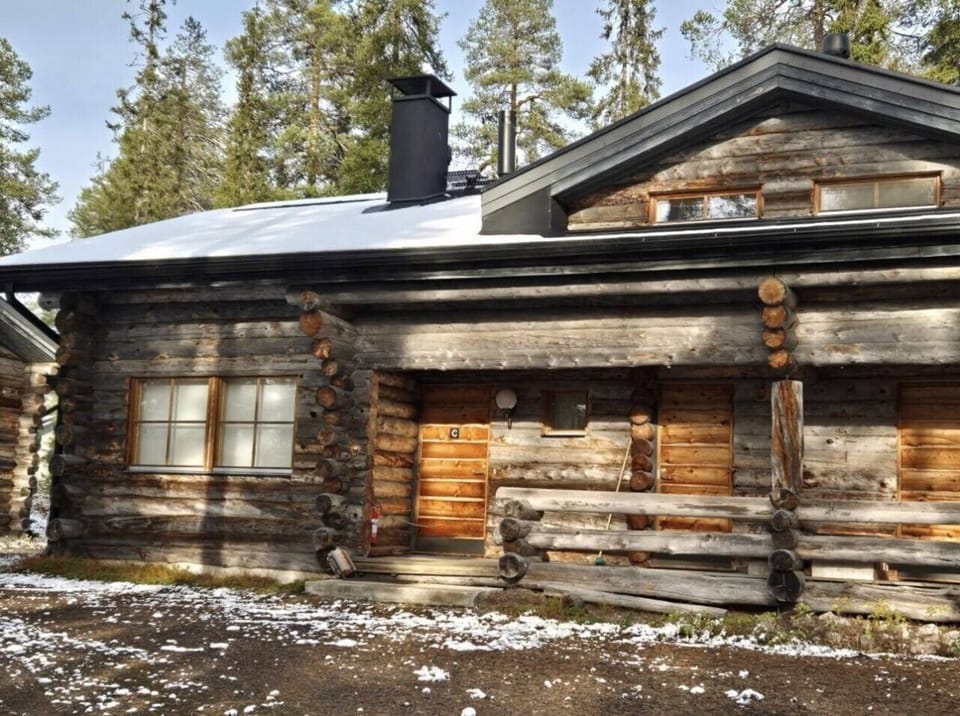 Exterior view of the log cabin with its traditional kelo log walls.