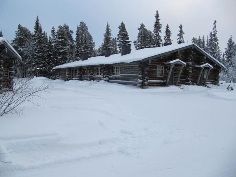 Exterior of the property blanketed in snow during the winter season.