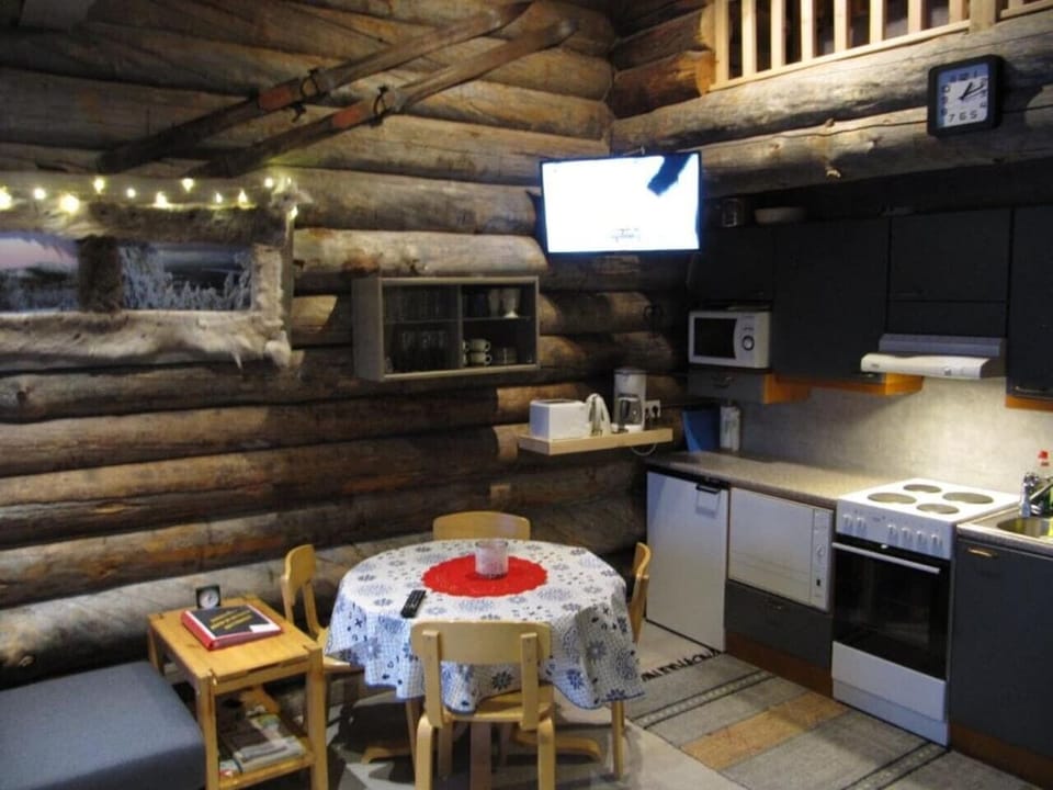 Well-equipped kitchen with a round dining table for gathering together.