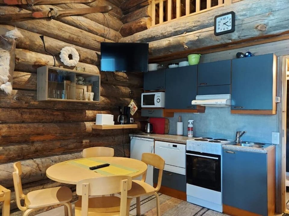 Kitchen with ample counter space and a round dining table.