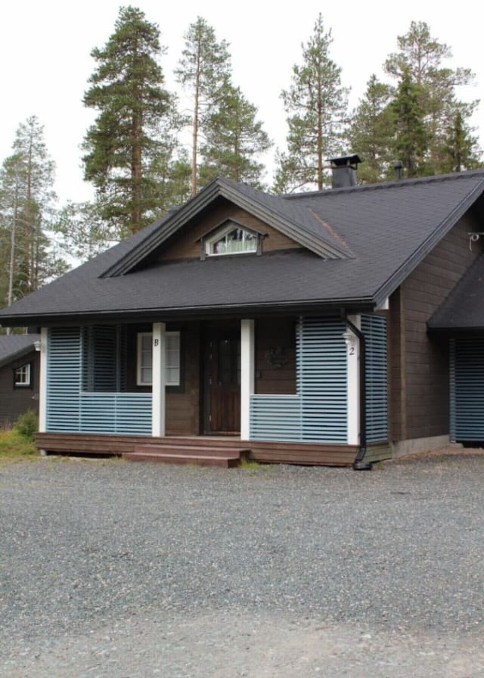 Front view of the house with a covered porch entrance.