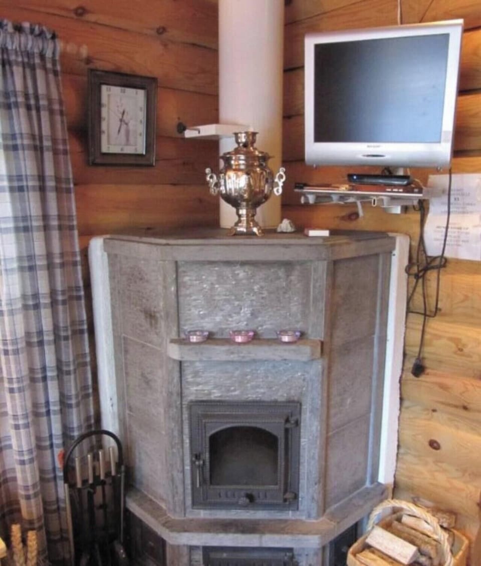 Traditional stone fireplace that keeps the living space warm and inviting.