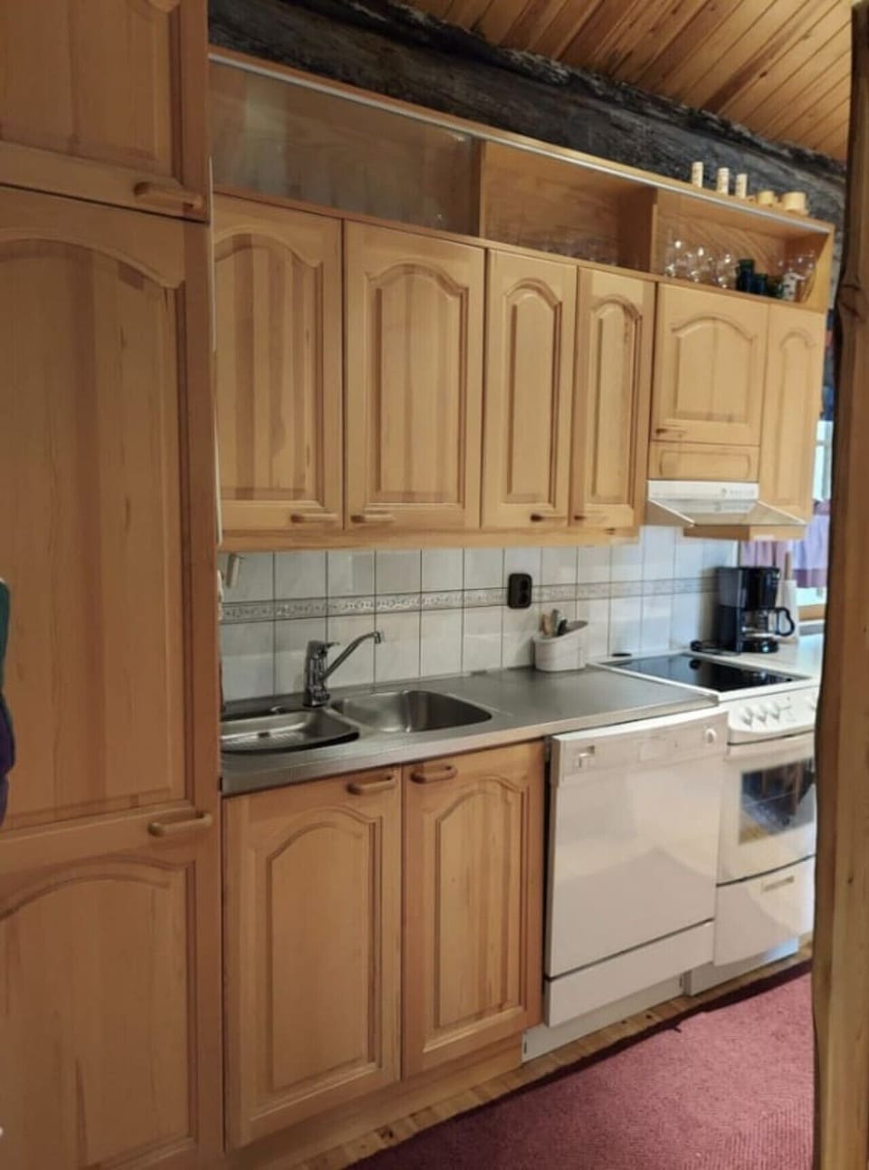 Kitchen with electric stove and coffee maker