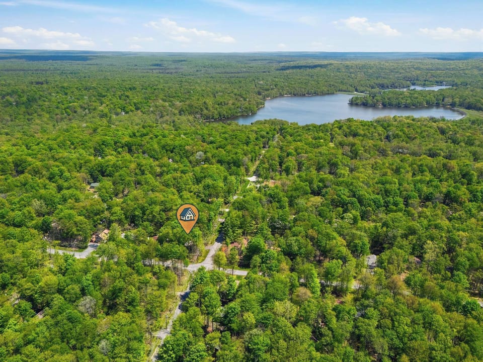 Surrounded by a sea of green! This aerial view shows just how wonderfully private and peaceful your stay will be.