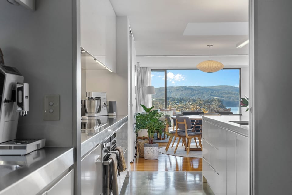 From your first espresso to evening entertaining, the thoughtfully equipped kitchen offers premium appliances for effortless cooking.