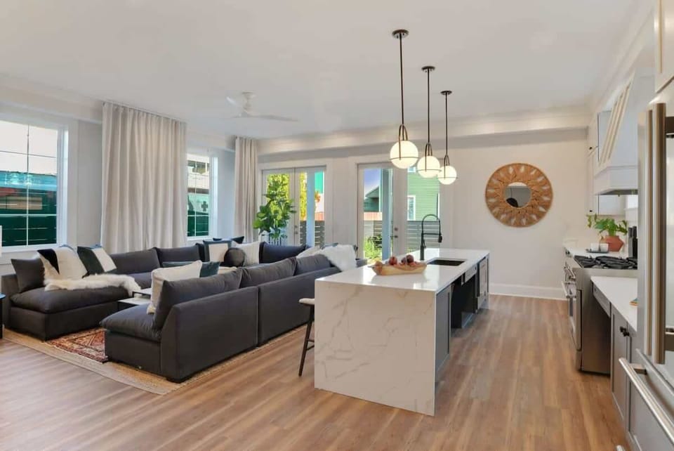 Open Concept Living Room & Chef's Kitchen | First Floor | Bar Seating | First Floor | Central Common Area 

