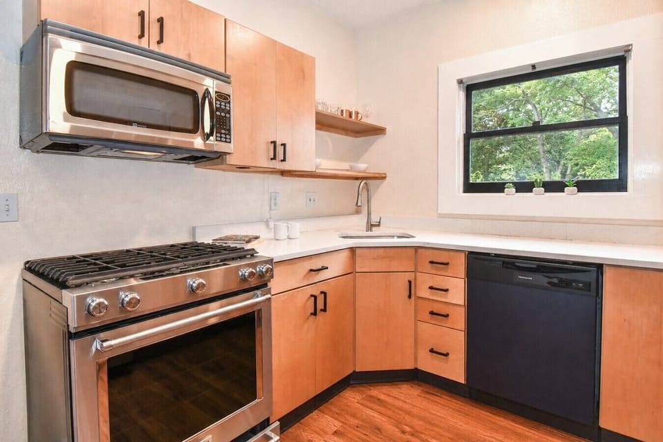 Well-equipped kitchen featuring modern appliances and plenty of counter space, making meal preparation easy and convenient during your stay.