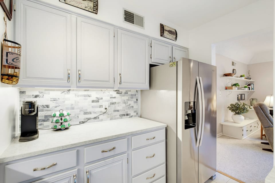 Plenty of cabinet and counter space, a full-size refrigerator, and a stocked Keurig coffee station make mornings easy.