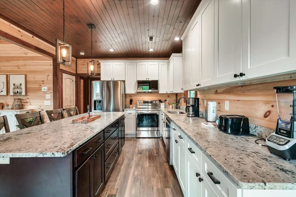 Beautiful kitchen with granite countertops and plenty of space to cook together.