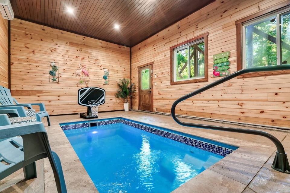Indoor Pool Retreat: Dive into fun with a private heated indoor pool and relaxing seating!