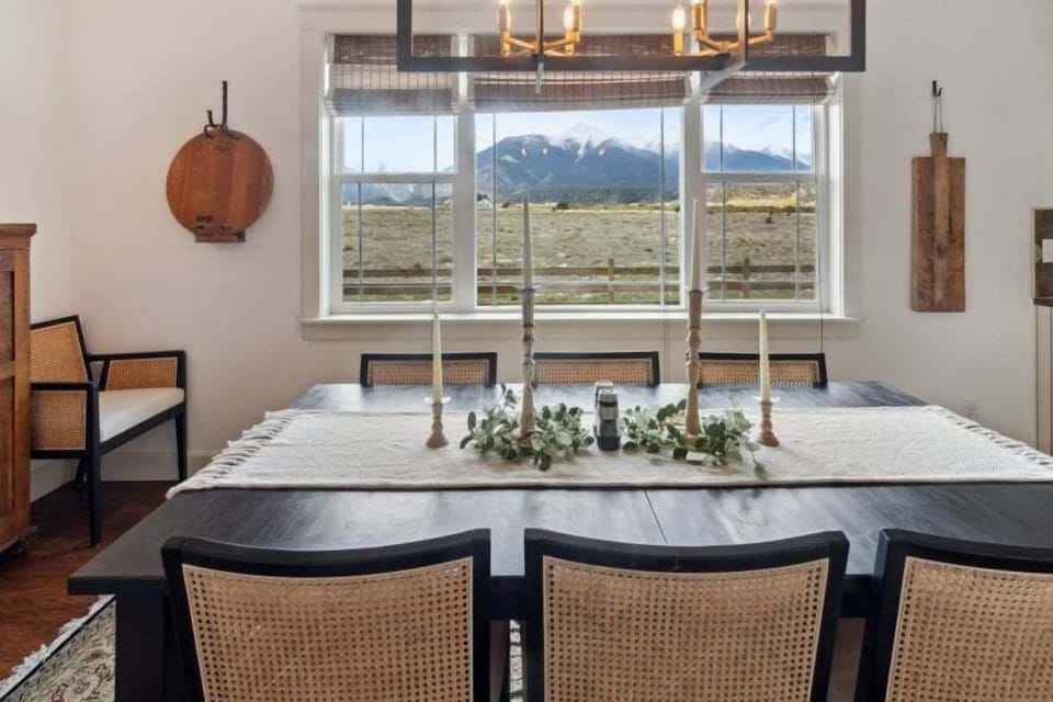 Gather around the large dining table with views of the mountains
