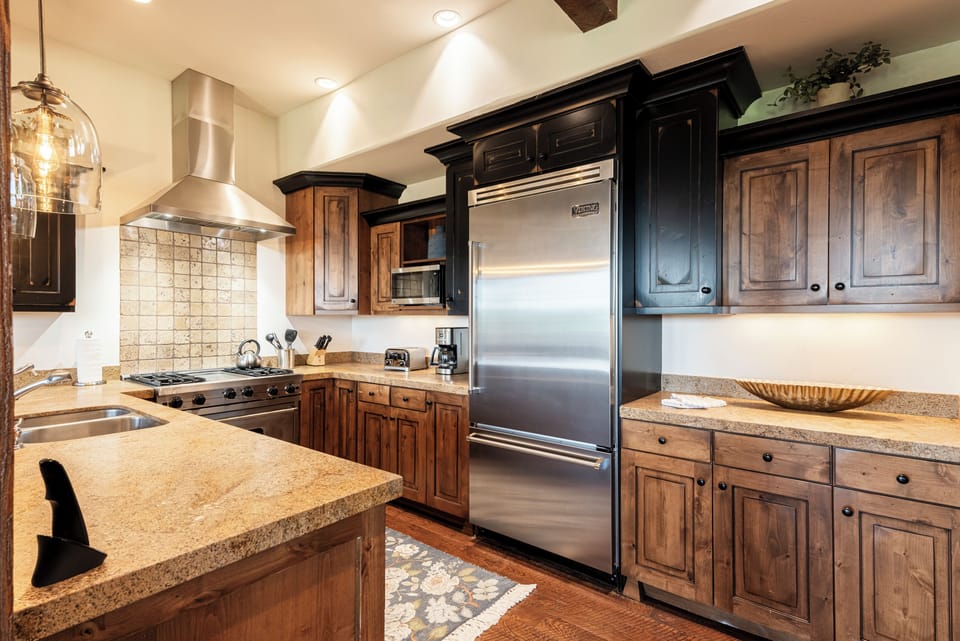 Sophisticated dark cabinetry and premium finishes