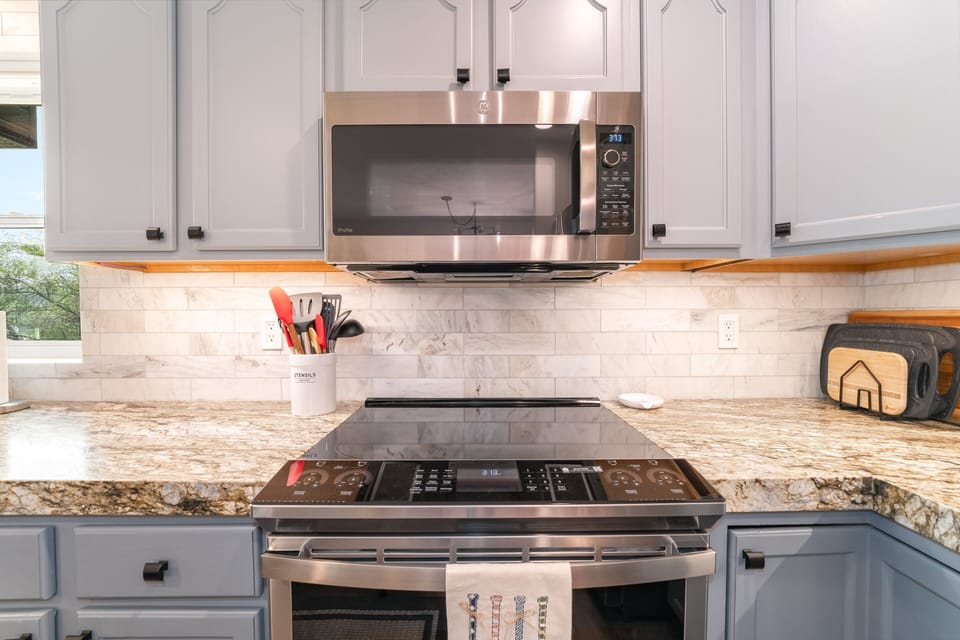 Stainless appliances and stylish finishes throughout I Upper Level