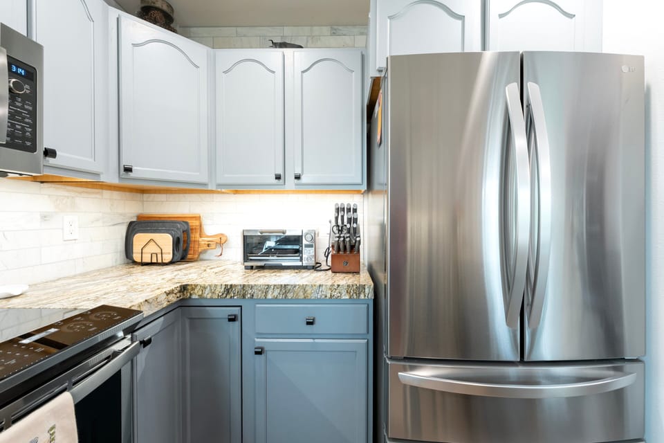 A tidy kitchen with all the essentials for whipping up a meal I Upper Level