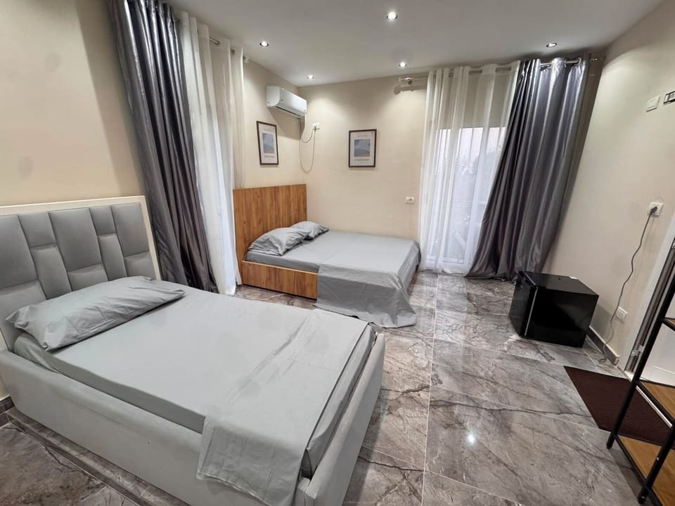 Family Quadruple Room, Balcony, Beach View | Desk, iron/ironing board (on request), WiFi (free)
