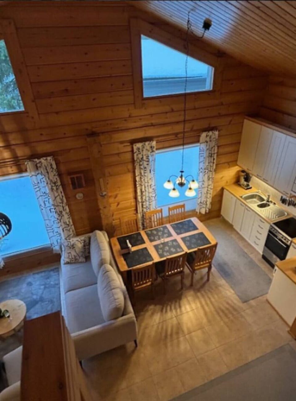 Open-plan kitchen and dining area seen from the loft.
