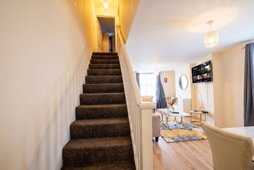 Welcoming hallway and stairs leading up to the peaceful bedrooms
