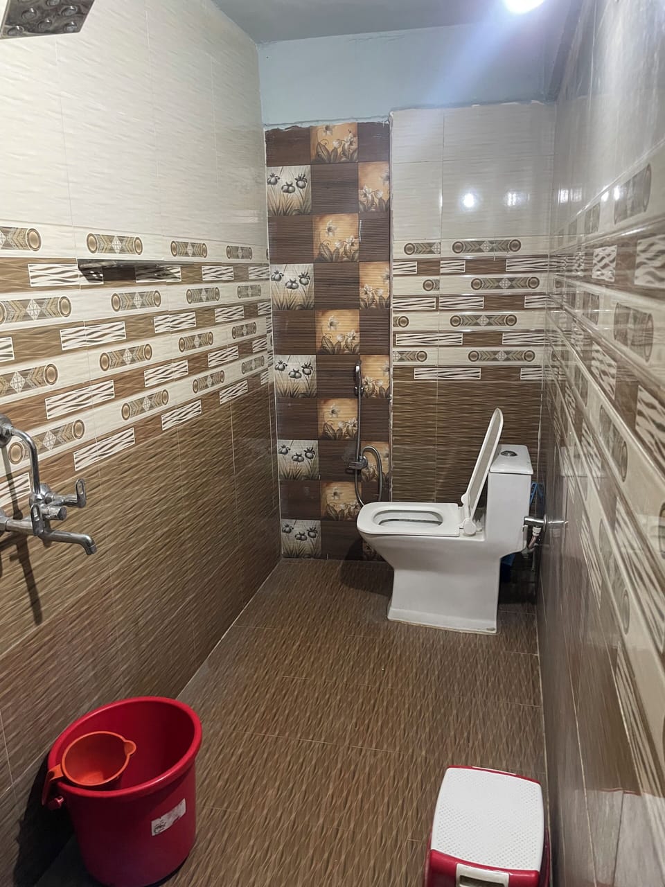 Shower, slippers, towels, toilet paper
