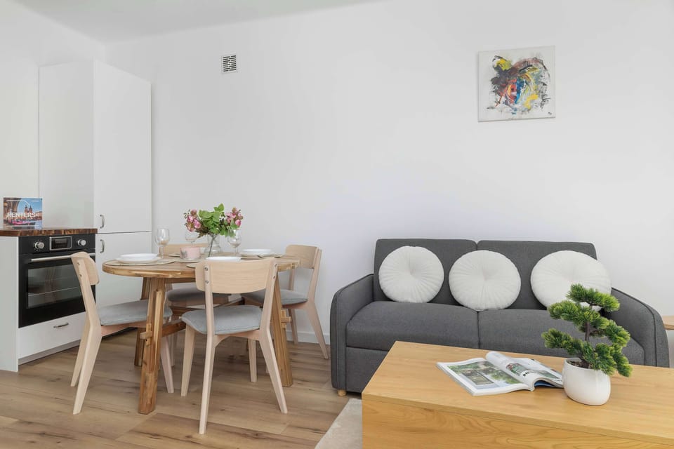 The living room has a modern look and comfortable furniture.