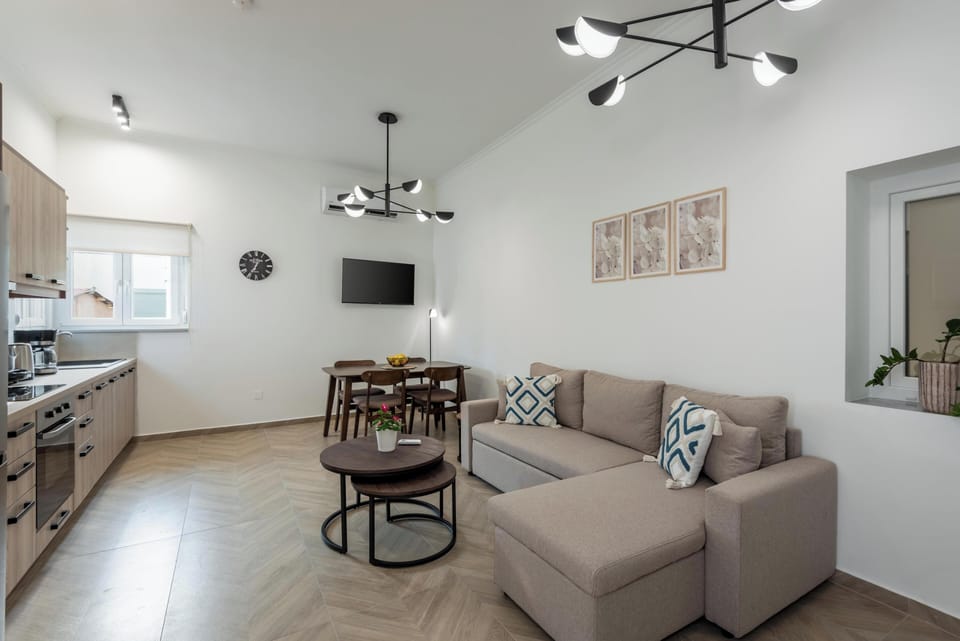 Comfort Apartment | Living area | 50-inch Smart TV with cable channels